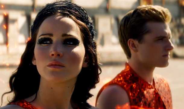 Screenshot from HungerGames Catching Fire featuring Katniss and Peter on final chariot ride in the capital.
