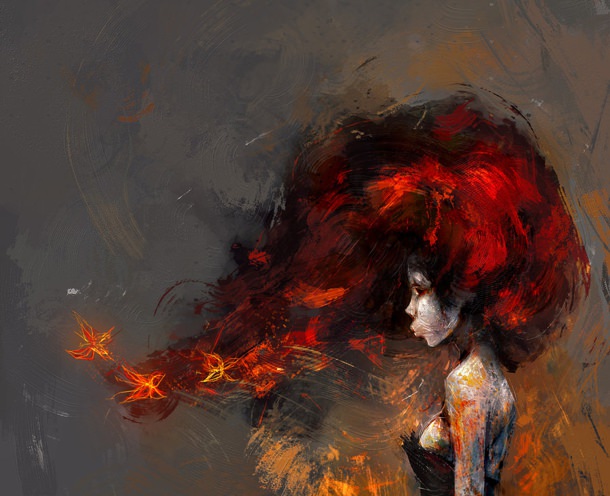 Woman with fiery red hair blows her hair into a flame.