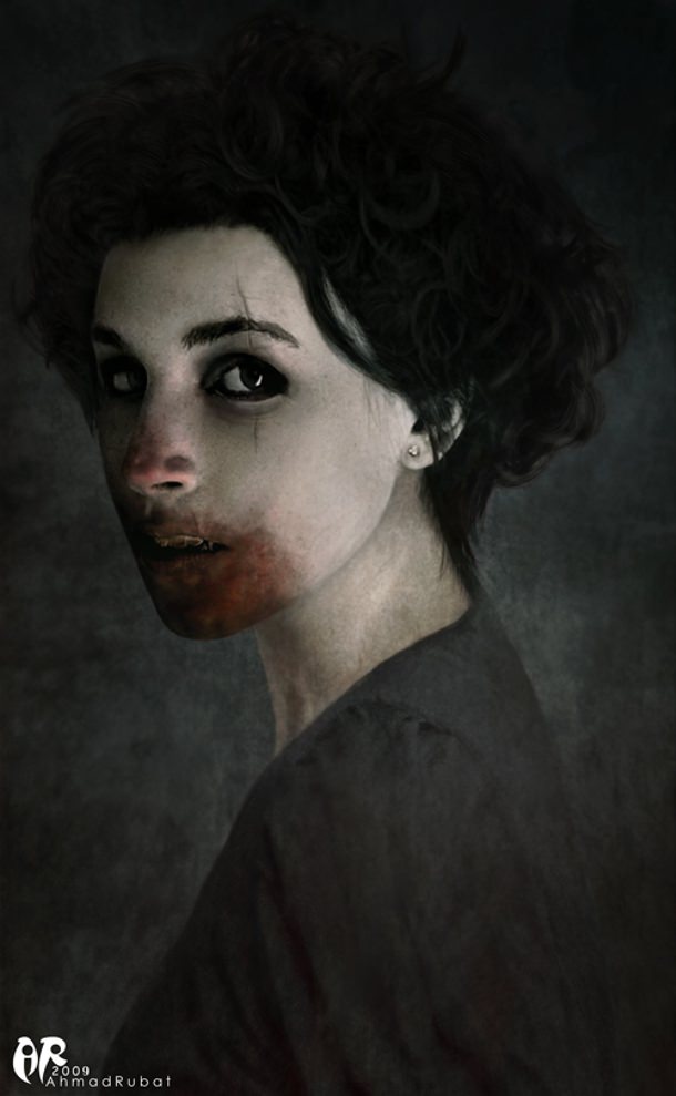 Female vampire with blood on her face after feeding